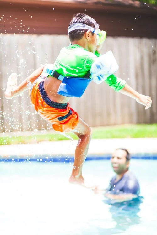 A kid swimming at the miller swmming pool A kid swimming at the miller swmming pool