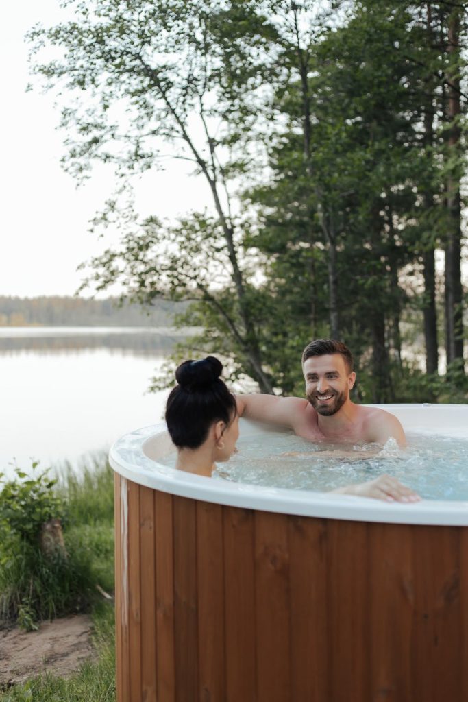 A man and a lady relaxing in a swim spa Pros and Cons of Swim Spas