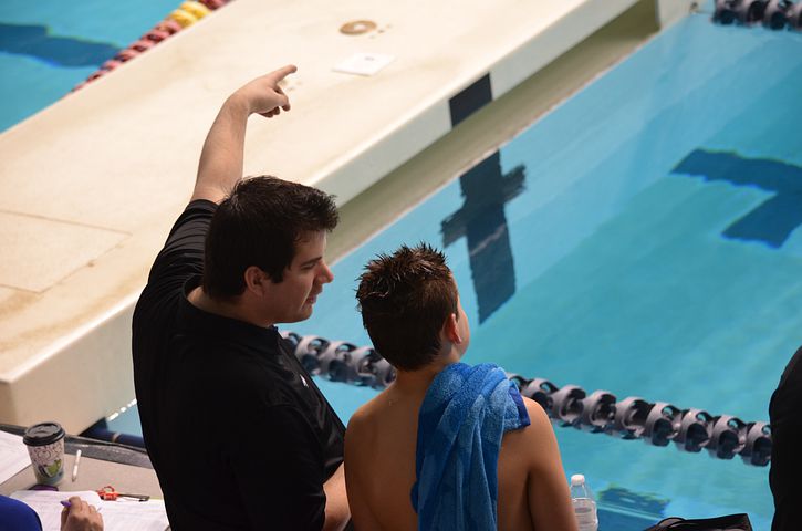 a swim official asking for a swimmer details Scoring a Swim Meet
