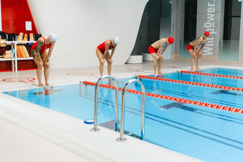 swimmers on swimming pool lane Scoring a Swim Meet