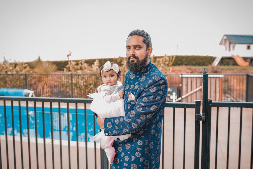 Father holding his daughter Dad and Baby Swimming Lessons