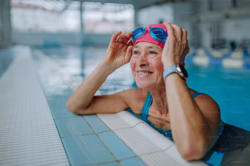 a happy old swimmer smiling because of her Sportsmanship Qualities