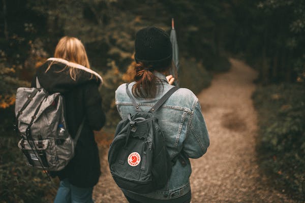 swimmers walking with swim backpacks