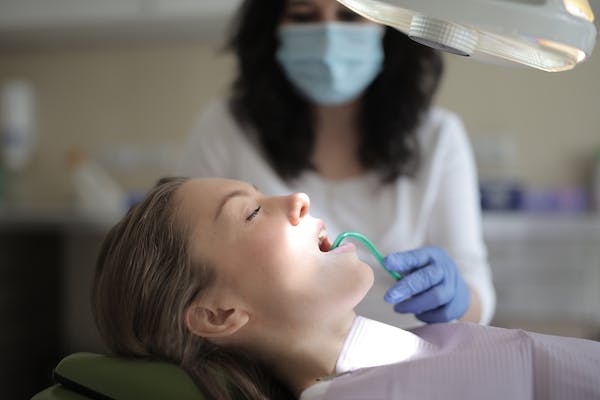 female patient receiving medical attention from a professional doctor