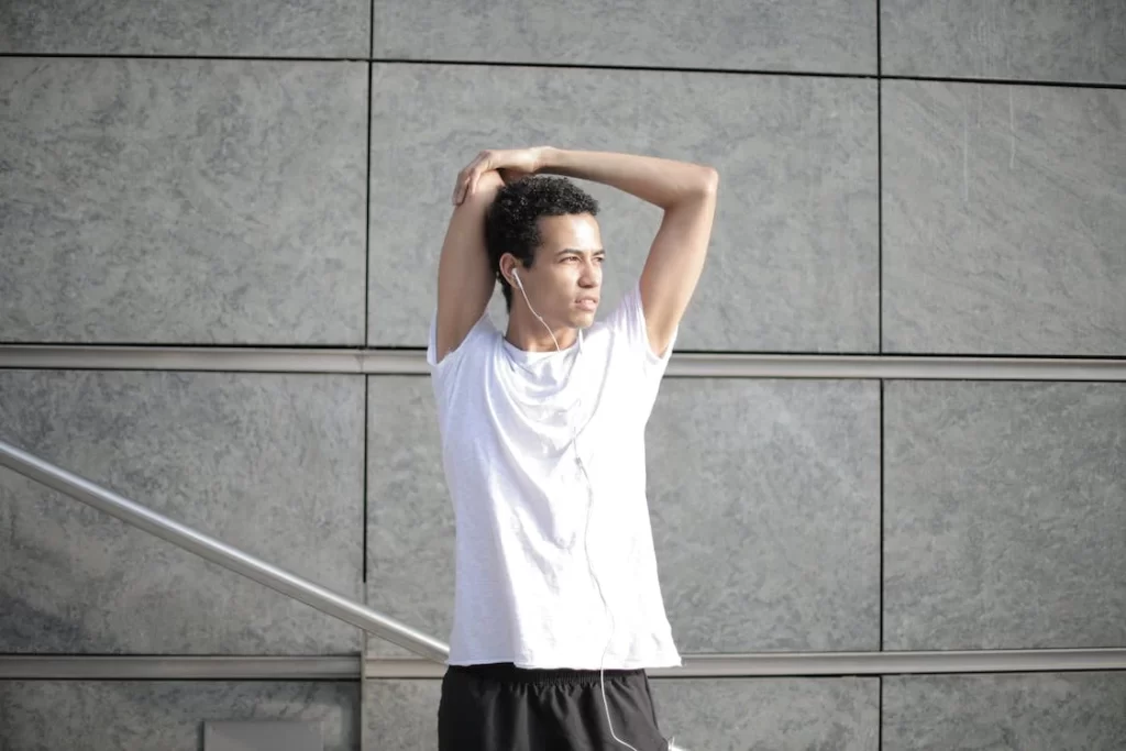 male swimmer practicing his swimming warm up sets