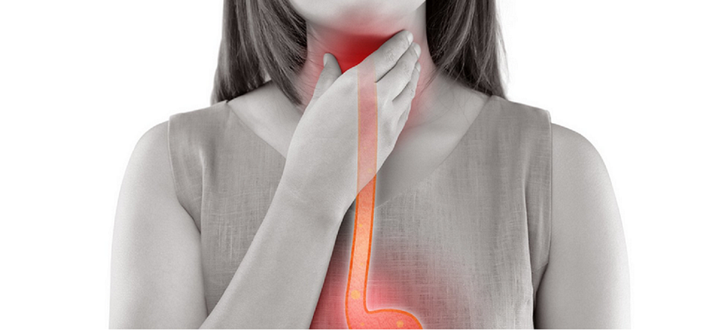 lady touching her sore throat after swimming