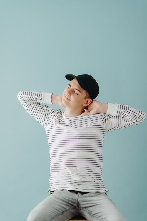 a male teenager stretching his neck