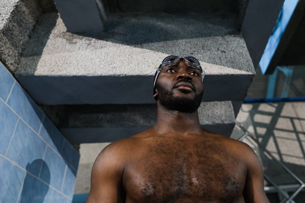 a hairy swimmer gazing at a pool