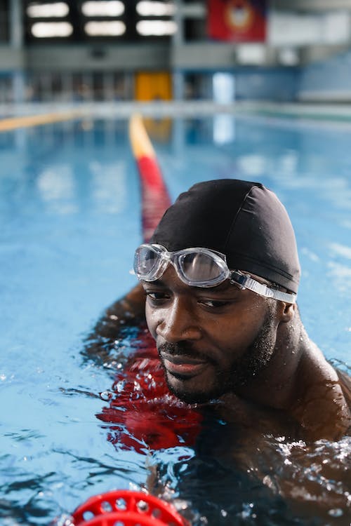 a hairy swimmer swimming in the pool