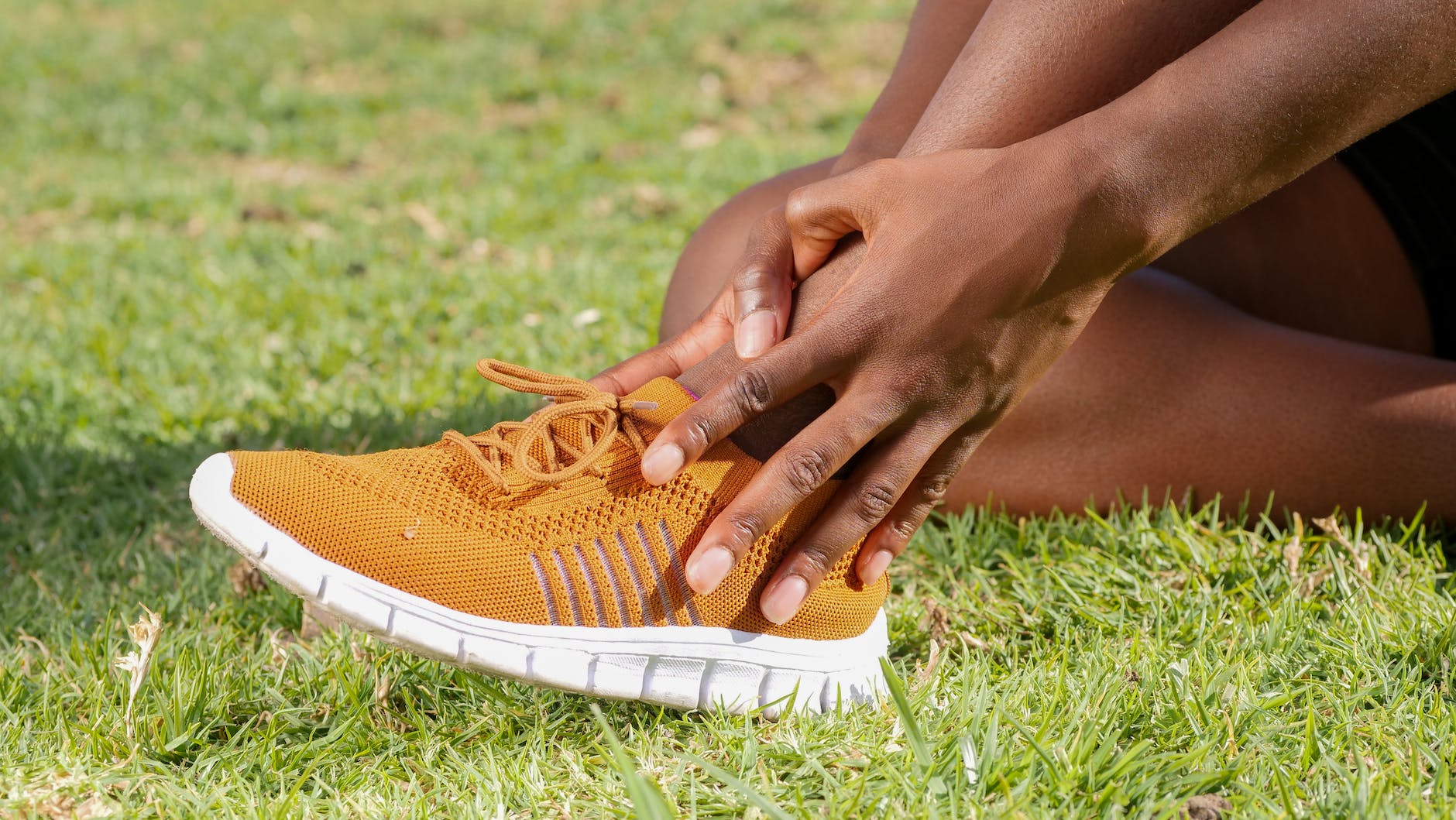 a person touching his ankle